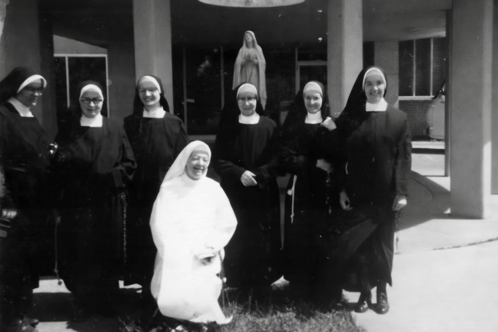 Sisters in front of Our Lady of Lourdes on St. Landry Street 