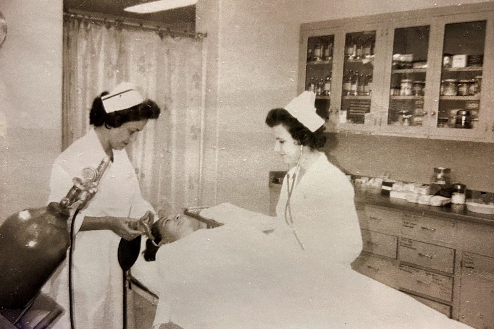 two nurses with patient