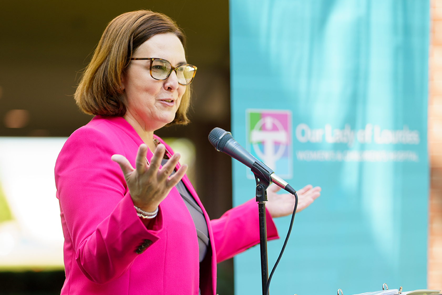 woman speaking at ceremony